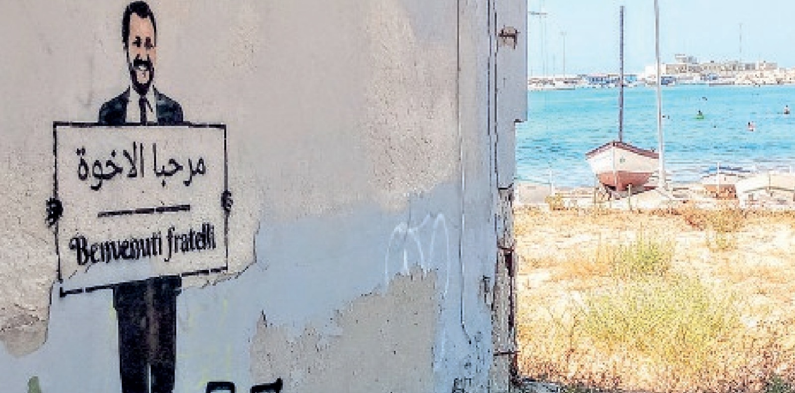 E il ministro Salvini dà il benvenuto ai fratelli arabi. Al porto di Pozzallo l’opera street art di Rabit